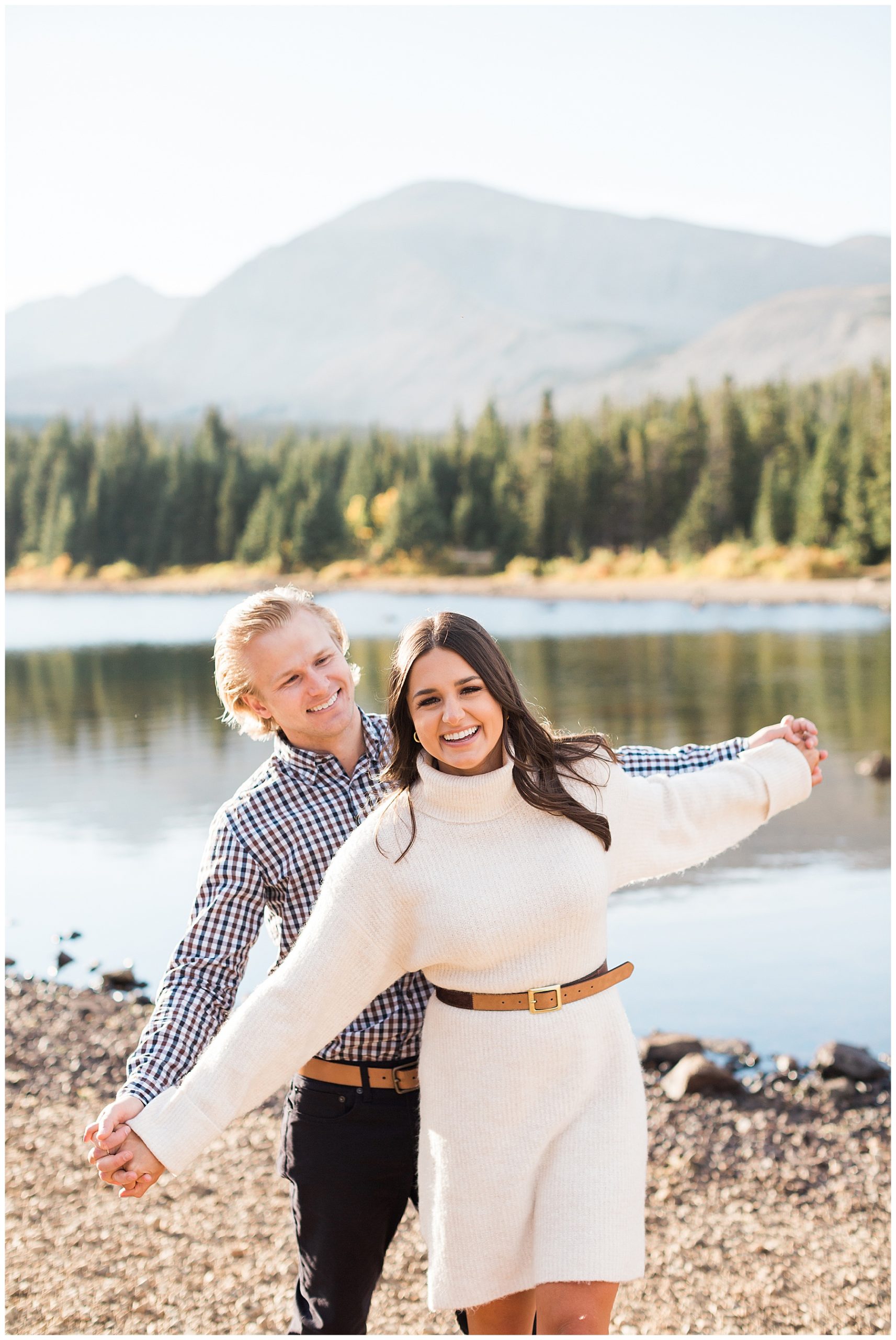 couple engagement shoot in front of the lake